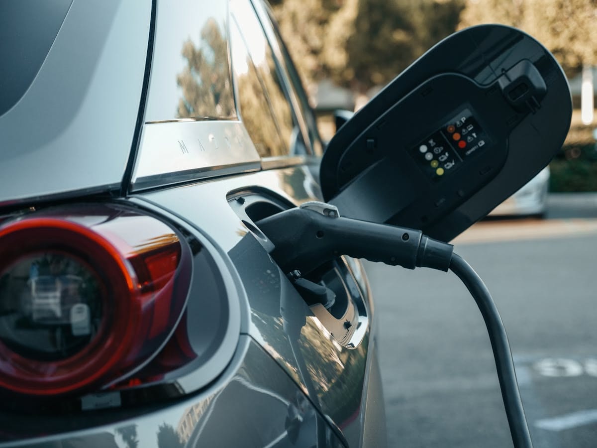 Industrial power meter installed in a DIN-rail panel at an EV charging station