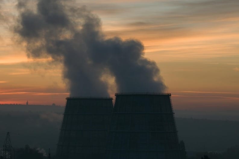Energy infrastructure at sunset with power monitoring systems